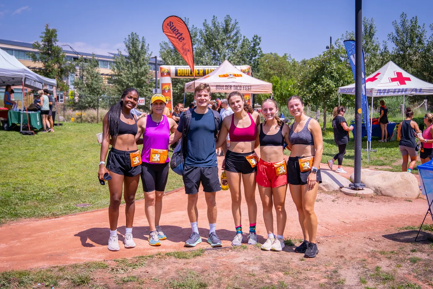A group of friends celebrating after finishing the Boulder 5K Taco Run